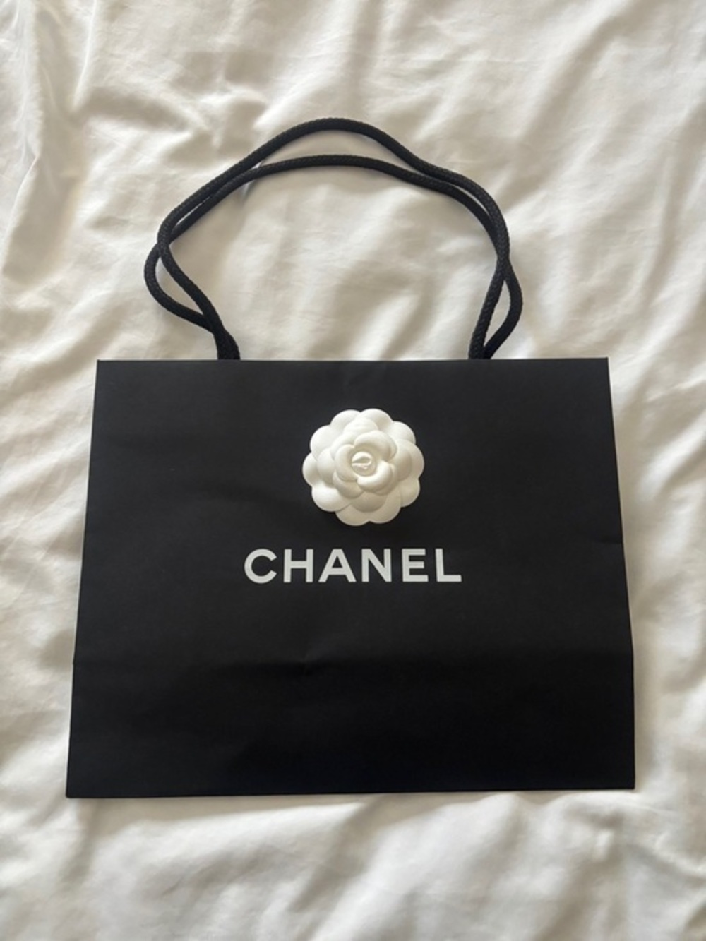 CHANEL Black Shopper Tote with White Camellia Emblem